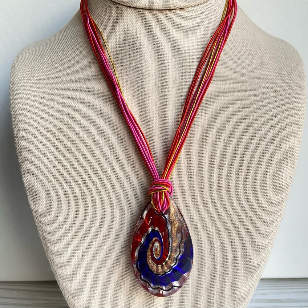 Art Glass Pendant Necklace in red blue and gold on colorful multi strand cord